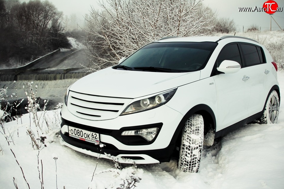 5 399 р. Накладка на передний бампер Ixion Style  KIA Sportage  3 SL (2010-2014) дорестайлинг (Неокрашенная)  с доставкой в г. Майкоп