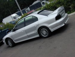 2 899 р. Козырёк на заднее стекло LIBERAL Mitsubishi Galant 8  дорестайлинг седан (1996-1998) (Неокрашенный)  с доставкой в г. Майкоп. Увеличить фотографию 2
