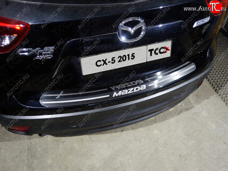 3 999 р. Накладка на задний бампер, ТСС Тюнинг  Mazda CX-5  KE (2015-2017) рестайлинг (лист шлифованный надпись MAZDA)  с доставкой в г. Майкоп