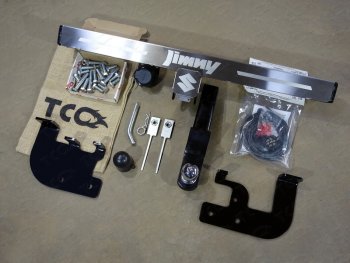 Фаркоп (тягово-сцепное устройство) TCC (с надписью) Suzuki Jimny  JB23/JB43 (2012-2018) 2-ой рестайлинг (Оцинкованный, шар E - нержавейка)